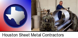 Houston, Texas - a sheet metal worker fabricating a metal tube