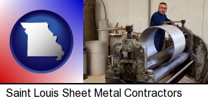 Saint Louis, Missouri - a sheet metal worker fabricating a metal tube