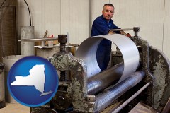 new-york a sheet metal worker fabricating a metal tube