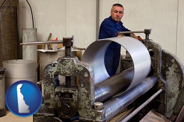 a sheet metal worker fabricating a metal tube - with Delaware icon